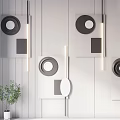 Modern Geometric Wall Decorations Featuring Circular Square Shapes On Gray Wooden Wall With Green Plant