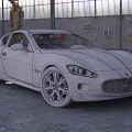 Gray Maserati Sports Car Parked In Industrial Garage With Large Windows
