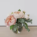 Beautiful Peach Peonies and White Roses in Glass Vase with Eucalyptus Leaves on Wooden Table