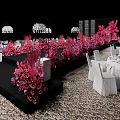 Elegant Banquet Hall Featuring Pink Floral Arrangements Black Stage White Tables Chandeliers And Patterned Carpet