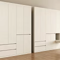 Modern White Wardrobe With Sleek Cabinet Doors And Drawers In Bright Room With Wooden Floor