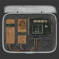 Open Metal Case Containing Electronic Components Circuit Boards Chips And Labels