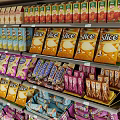 Retail Display Shelves Stocked With Various Snacks Drinks And Packaged Goods In Modern Store