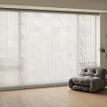 White Sheer Curtains Covering Large Window With Gray Armchair And Potted Plant