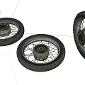 Detailed View of Three Motorcycle Tires with Wheels and Spokes on White Background