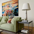 Bright Modern Living And Dining Room Interior With Green Sofa Coffee Table Artwork And Plant
