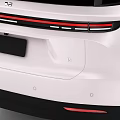 Sleek White Modern Electric Car With Black Roof Wheels And Futuristic Front Fascia Design