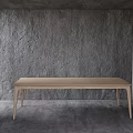 Light Colored Wooden Dining Table In Minimalist Modern Room With Gray Wall And Floor