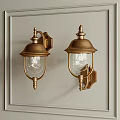 Classic Brass Wall Lamps with Transparent Glass Shades Mounted on Beige Wall