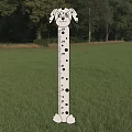 Cartoon Dog Shaped Height Measuring Tool in Green Grass Field with Trees