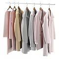 Multiple Soft Colored Long Coats Hanging On Wooden Hangers With Casual Style And Long Sleeves