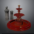 Red Multi Tiered Fountain With Stone Pillars And Ornate Gold Details