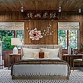 Hotel Guest Room Featuring Chinese Style Wooden Decor Lotus Wall Art And Traditional Windows