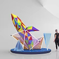 Colorful Geometric Sculpture With Blue Star Pattern Base And Transparent Cones Near Woman