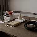 Wooden Table With Clock Cup Books Vase And Black Coil Near Gray Curtains And Sink
