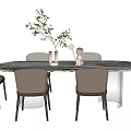 Modern Dining Table Set with Round Marble Tabletop and Light Gray Chairs and Green Plant