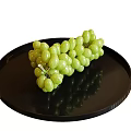 Fresh Green Grapes Neatly Placed On A Black Round Tray