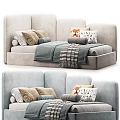 Cozy Light Colored Sofa Bed With Patterned Pillows And Striped Blanket