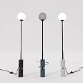 Three Modern Floor Lamps With Textured Black Blue Gray Bases And Round White Shades