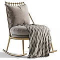 Cozy Rocking Accent Chair With Gold Metal Frame Gray Cushion And Patterned Blanket