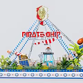 Vibrant Pirate Ship Amusement Ride with Red Sign Palm Trees and Lighthouse Decor