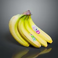 Ripe Fresh Yellow Bananas Bunch With Brand Stickers On Shiny Surface