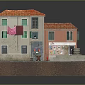 Miniature House Model With Red Roof Weathered Walls Green Shutters And Pink Clothes On Clothesline