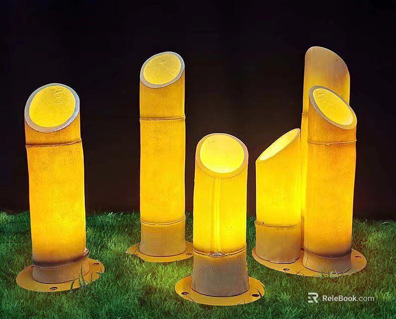 Bamboo Shaped Outdoor Lights Standing on Green Grass with Warm Yellow Glow in Night Scene 3d model 