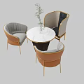 Elegant Table Chair Set With Marble Tabletop Gray Brown Upholstered Cushions Gold Legs and Plant