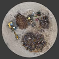 Yellow Excavator Operating At Scrap Metal Recycling Yard With Piles Of Waste And Blue Dumpsters