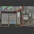 Weathered Electrical Control Panels With Colorful Graffiti Exposed Wires And Junction Boxes