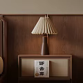 Wooden Nightstand With Pleated Lampshade And Book On Wooden Wall Background
