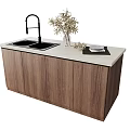 Bar Counter Featuring Double Sink Black Faucet White Countertop Wooden Cabinets Potted Plant and Plate