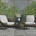 Outdoor Rattan Casual Sofa Set With Two Chairs Small Table Vase And Green Plants