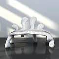Modern Metallic Single Chair With Sculptural Curved Legs And Shiny Surface