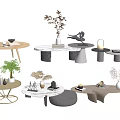Modern Coffee Tables With Various Designs And Decorative Elements Like Vases And Plants 3d model
