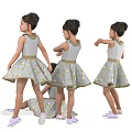 Little Girl In Gray Floral Dress With Bow And Sneakers In Various Poses