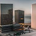 Modern Tall Buildings With Glass Facades And Ocean View At Sunset