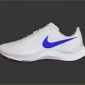 White Nike Running Shoes Featuring Blue Swoosh Logo And Red Toe Design On Gray Surface