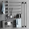 Sleek Modern Bathroom Accessories With Towel Bars Towels Aromatherapy Sticks And Toiletries On Gray Wall
