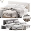 Double Bed With Gray Striped Bedding White Pillows And Textured Fabric Detail
