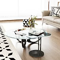 Modern Glass Coffee Table With Books Vase Plant And Sofa In Living Room