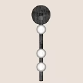 Modern Dark Metal Wall Lamp with Three White Spherical Lampshades on Light Colored Wall