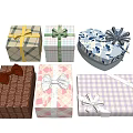 Assorted Gift Boxes Featuring Colorful Patterns And Decorative Ribbon Bows