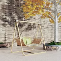 Natural Rattan Outdoor Swing Chair With Green Cushions In Garden By Yellow Leaf Tree