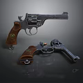 Two Different Sizes Revolvers With Metal Body And Brown Wooden Grips On Dark Background