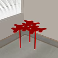 Red Abstract Leaf Shaped Side Table With Slender Legs In Room Corner 3d model