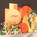 Elegant LOGO Display With Orange Yellow Geometric Forms And Floral Arrangements