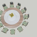 Round Dining Table Set With Green Patterned Chairs And White Plate Yellow Flowers
