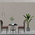 Interior Table And Chair Set With Brown Upholstered Chairs Round Small Table Green Plant And Books